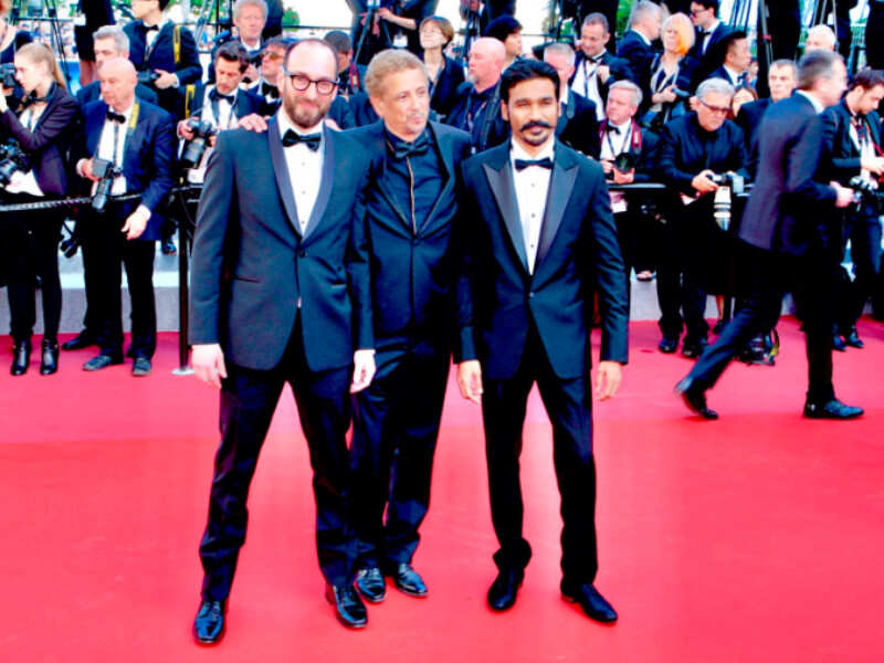 Dhanush looked handsome in a black suit Dhanush looked handsome in a black suit